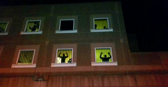 Inmates at the windows of Boston jail as protests against police violence streamed past.